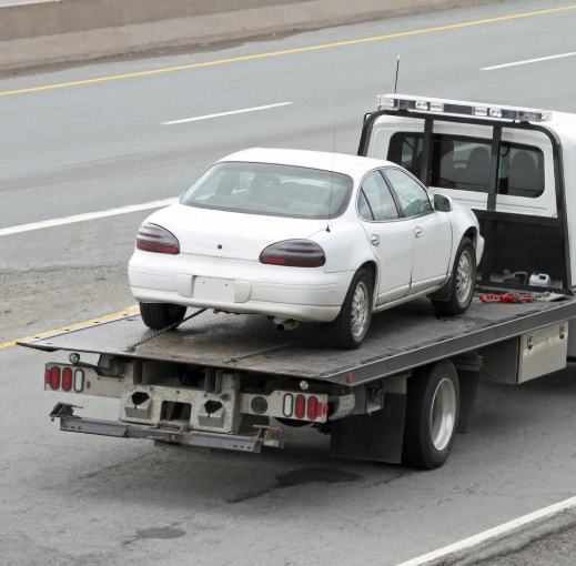 Car secured on a flatbed recovery truck