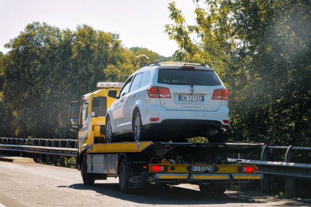 Car loaded on a recovery truck at the roadside